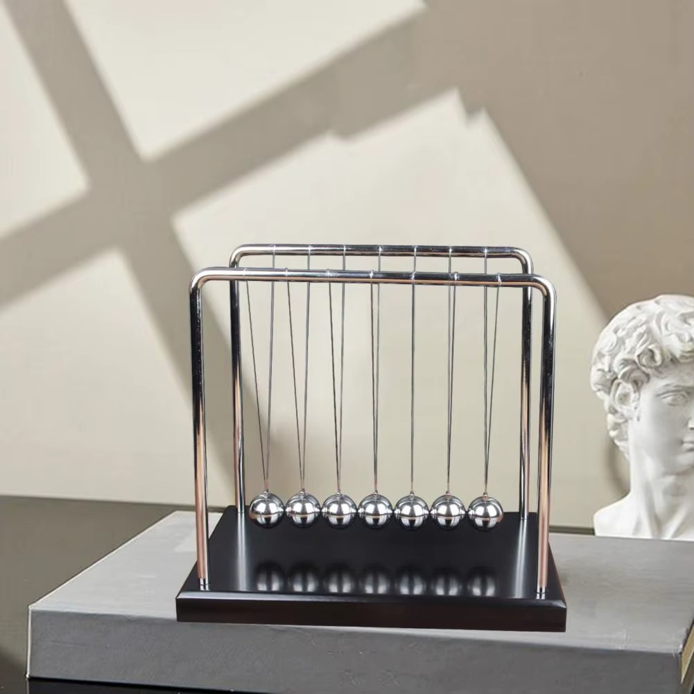 Modern geometric Newton's cradle with a black base and mirror finish frame as a decorative kinetic piece for a work desk (fits SKU_1748792312012_490, SKU_1748792312012_491)