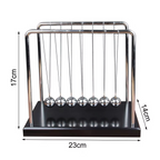 Large Newton's cradle about 23 by 14 by 17 cm with a black base and steel balls as a bold executive desk statement piece (fits SKU_1748792312012_491)