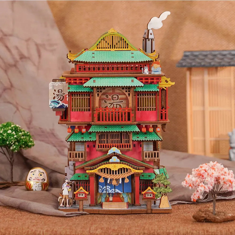 Japanese bathhouse puzzle kit with a motion sensor roof that opens and glows with warm LED lighting for desk display