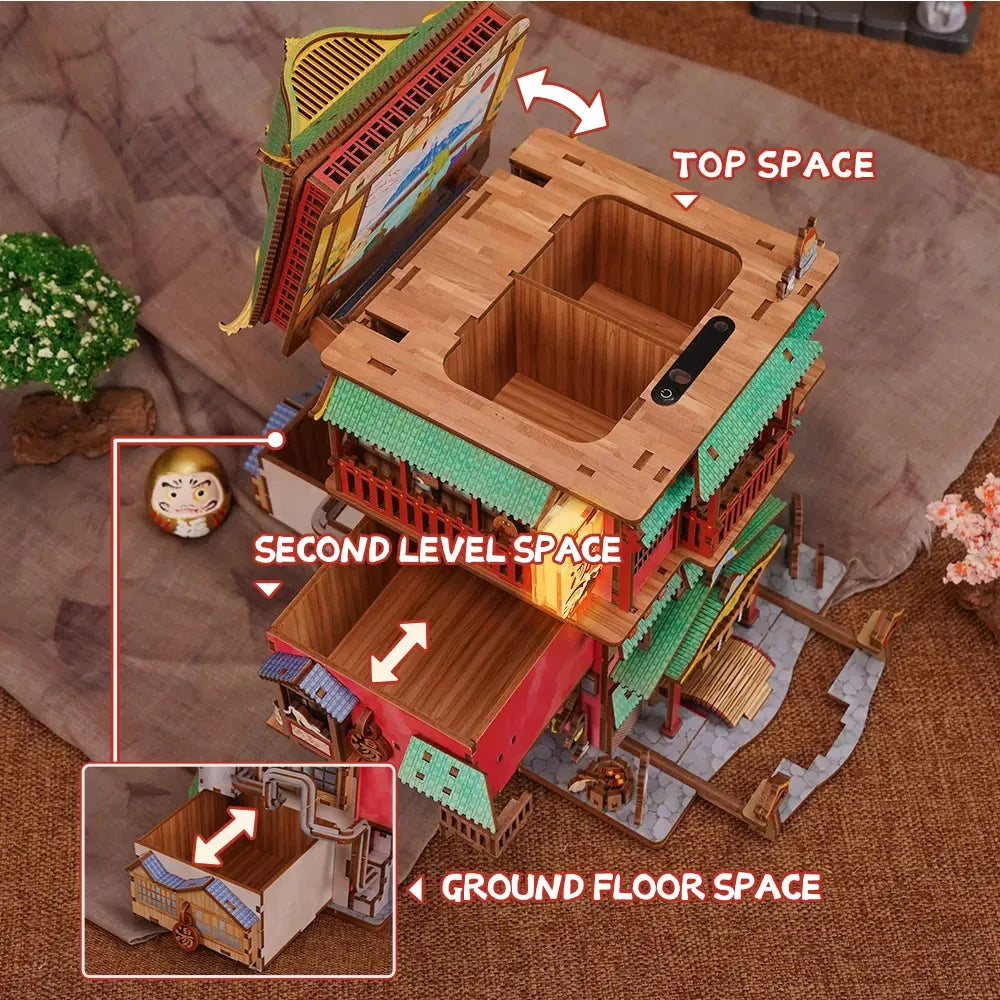 Miniature Japanese bathhouse kit with a pull out phone holder and hidden storage for a tidy desktop organizer setup