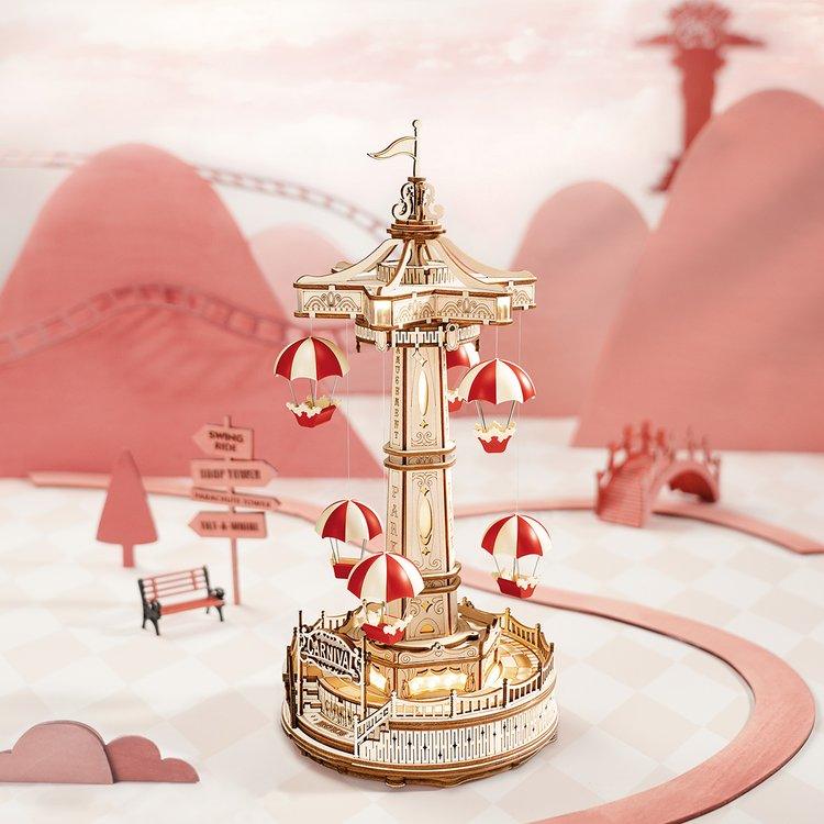 Illuminated fairground parachute drop puzzle set in a whimsical amusement park scene, a hands-on craft gift for hobbyists