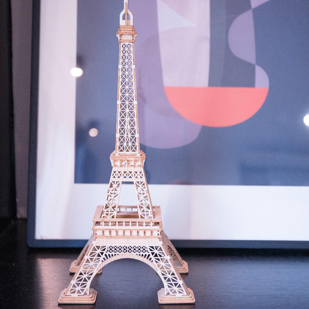 Assembled Eiffel Tower model styled as Paris themed home decor, a wooden architecture puzzle and display piece for any room