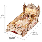Hands on wooden model kit assembling a playable pinball machine from precisely cut sustainable wood pieces