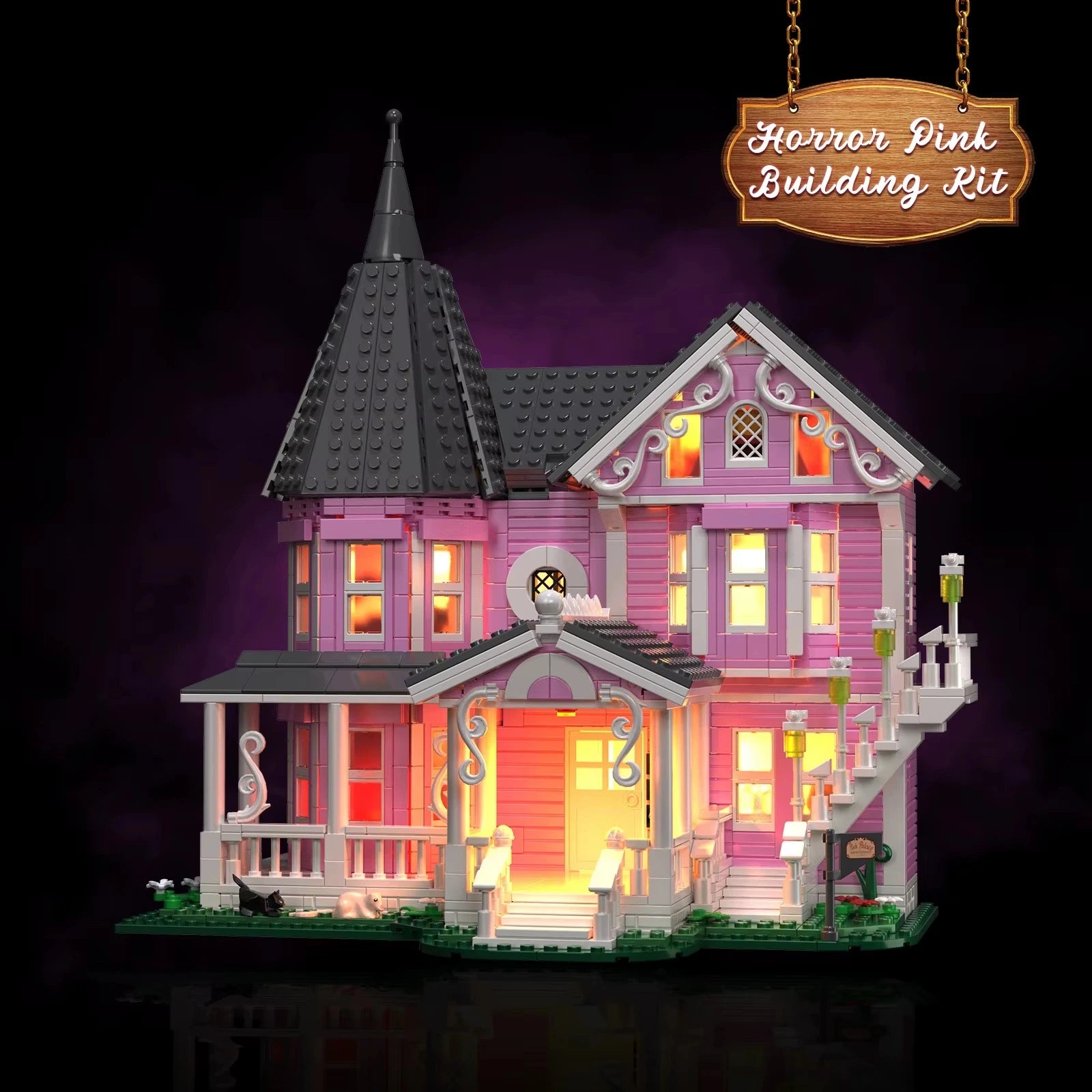 Pink Palace haunted mansion with warm amber light glowing through every window, a LED gothic display centerpiece for collectors