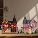 Open back Pink Palace haunted house with a three story furnished interior and lit facade for gothic mansion collectors and decor