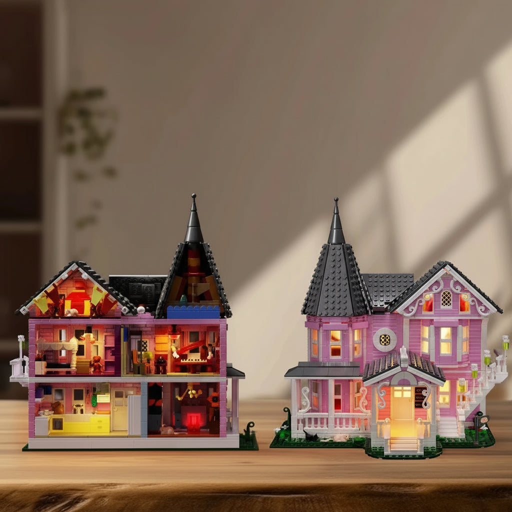 Open back Pink Palace haunted house with a three story furnished interior and lit facade for gothic mansion collectors and decor