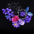 Gothic black rose paired with deep purple and lavender roses that create a dark romantic floral arrangement for shelves