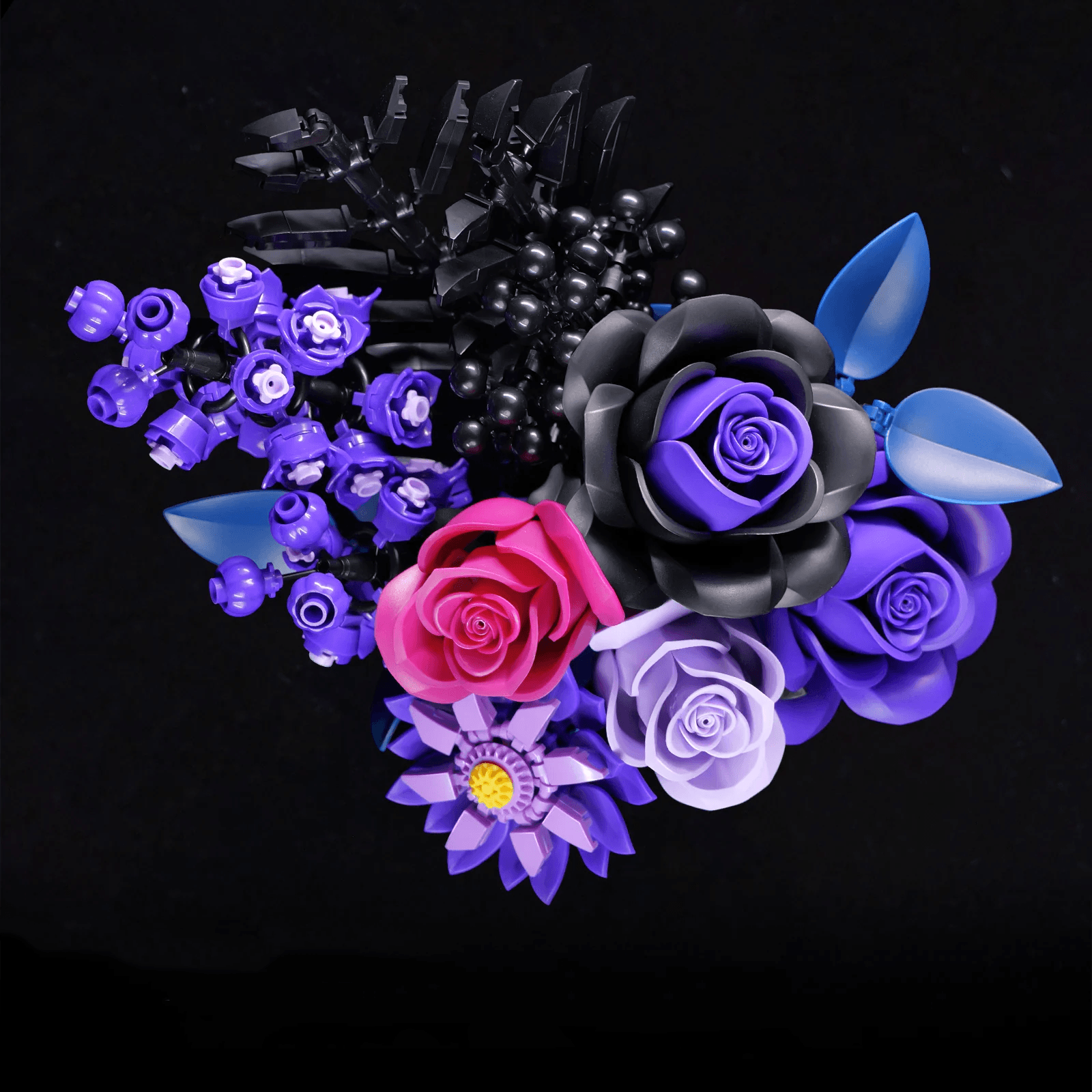 Gothic black rose paired with deep purple and lavender roses that create a dark romantic floral arrangement for shelves