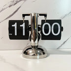 Black flip clock with a polished metal stand and large numbers as a retro living room and office desk accent Flipping_Clock_Black_1 Flipping_Clock_Black_2
