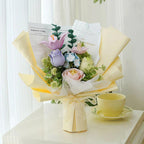 No wilt artificial flowers form an everlasting flower bouquet that brightens any room as a home decor centerpiece