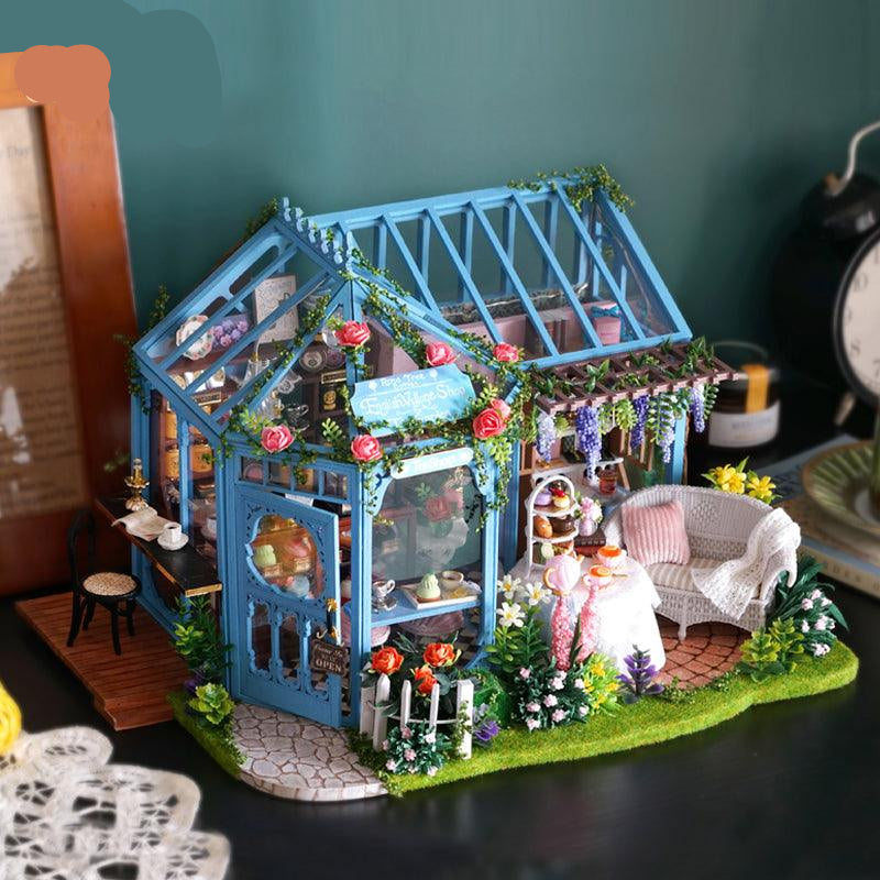 Finished 1:24 rose garden tea house dollhouse kit with glass conservatory, climbing roses, and an LED lit floral patio