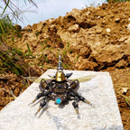 Rotatable metal beetle kit with a gear motor that spins the body, a kinetic insect sculpture for desk display