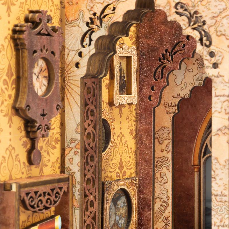 Carved pendulum wall clock and Gothic arched window in a maritime book nook diorama for a lit bookshelf display