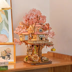 Two-story treehouse wooden model with a wraparound balcony and spiral staircase, a sakura puzzle for hobby model builders