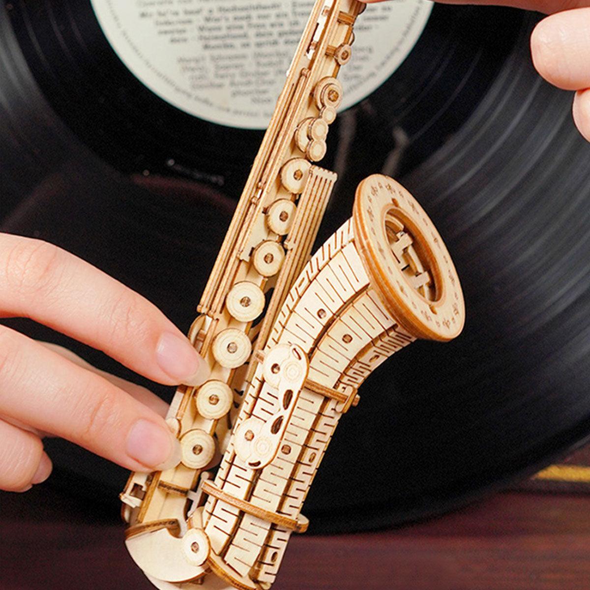 Handcrafted wooden saxophone puzzle for music lovers, a screen free hobby model that pairs with a vinyl record shelf