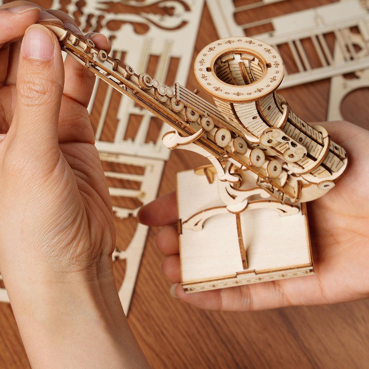 Glue free saxophone model kit with 136 interlocking wooden pieces to assemble, a relaxing hands on build for beginners