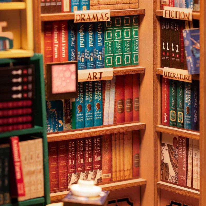 Detailed miniature bookshop shelves with tiny labeled folios and classics, a Tudor book nook for literature lovers