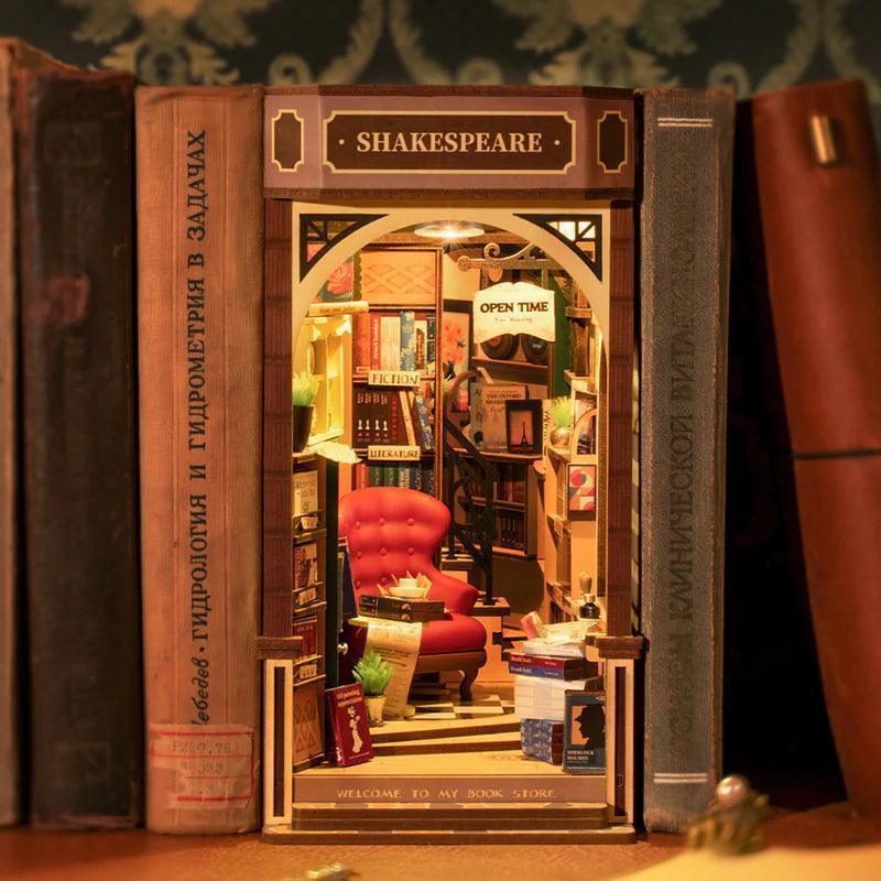 Shakespeare book nook slotting between real books as a bookshelf insert, a Tudor bookshop bookend for bibliophiles