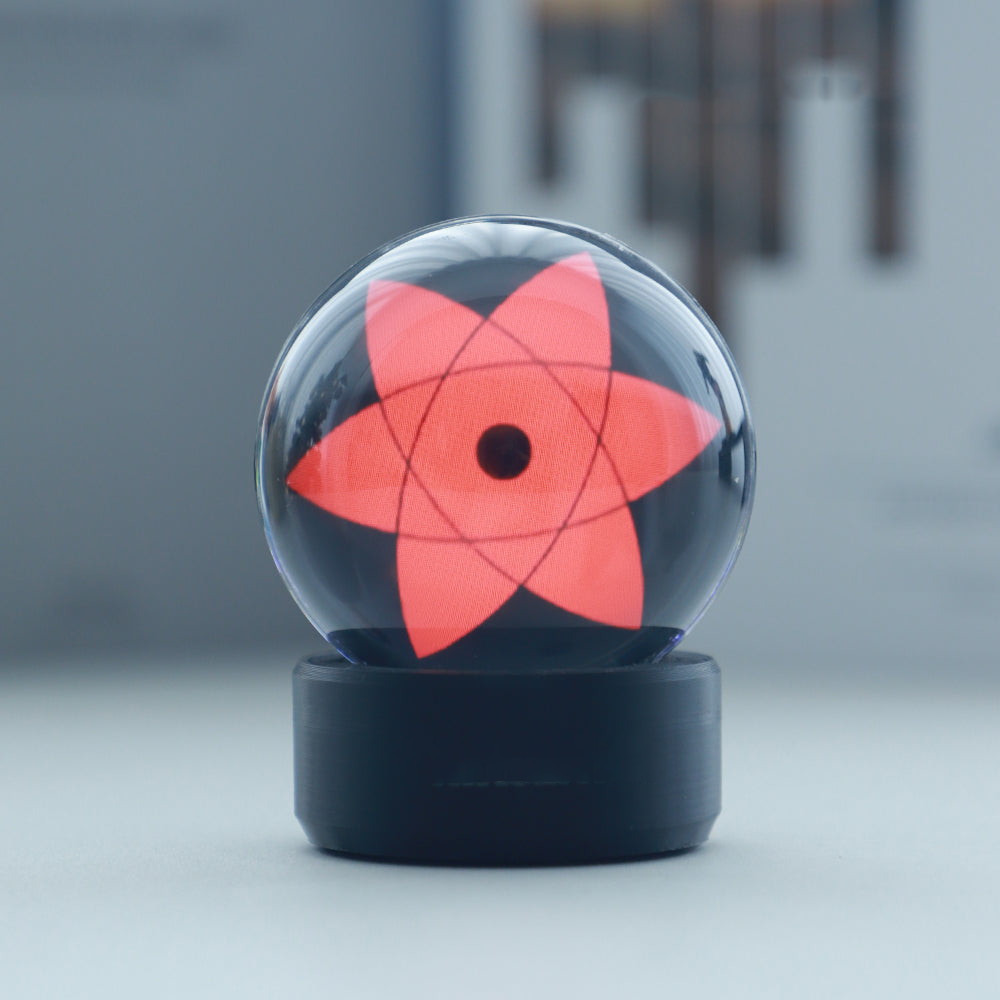 LED crystal sphere bluetooth speaker casting shifting light as ambient anime decor for a nightstand or shelf
