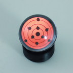 Sharingan anime bluetooth speaker with touch wheel for play, pause, and volume as a glowing desk centerpiece
