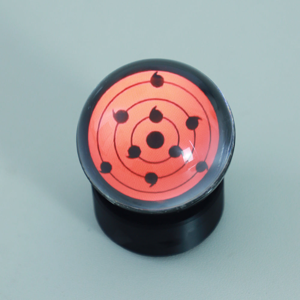 Sharingan anime bluetooth speaker with touch wheel for play, pause, and volume as a glowing desk centerpiece