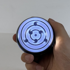 Wireless crystal ball speaker with illuminated Sharingan display as a birthday or holiday gift for anime fans