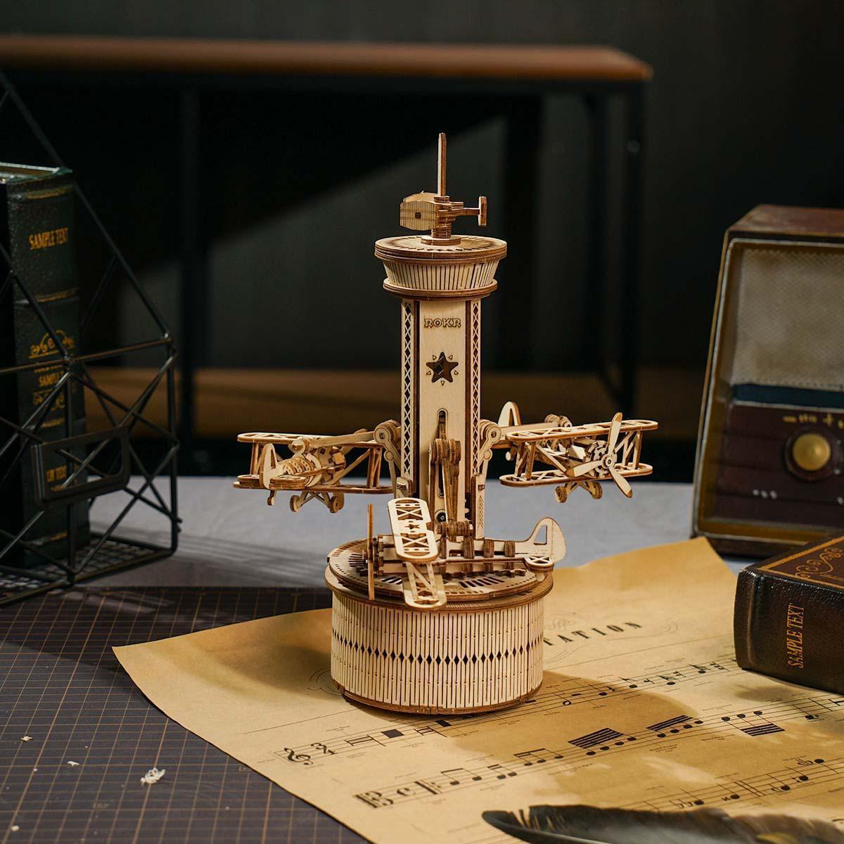 Sky Command musical tower wooden music box kit with three rotating biplanes, a 255 piece mechanical aviation desk display