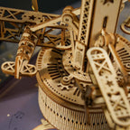 Wooden control tower model with three biplanes rotating on gear-driven motion, a wind-up music box for aviation fans