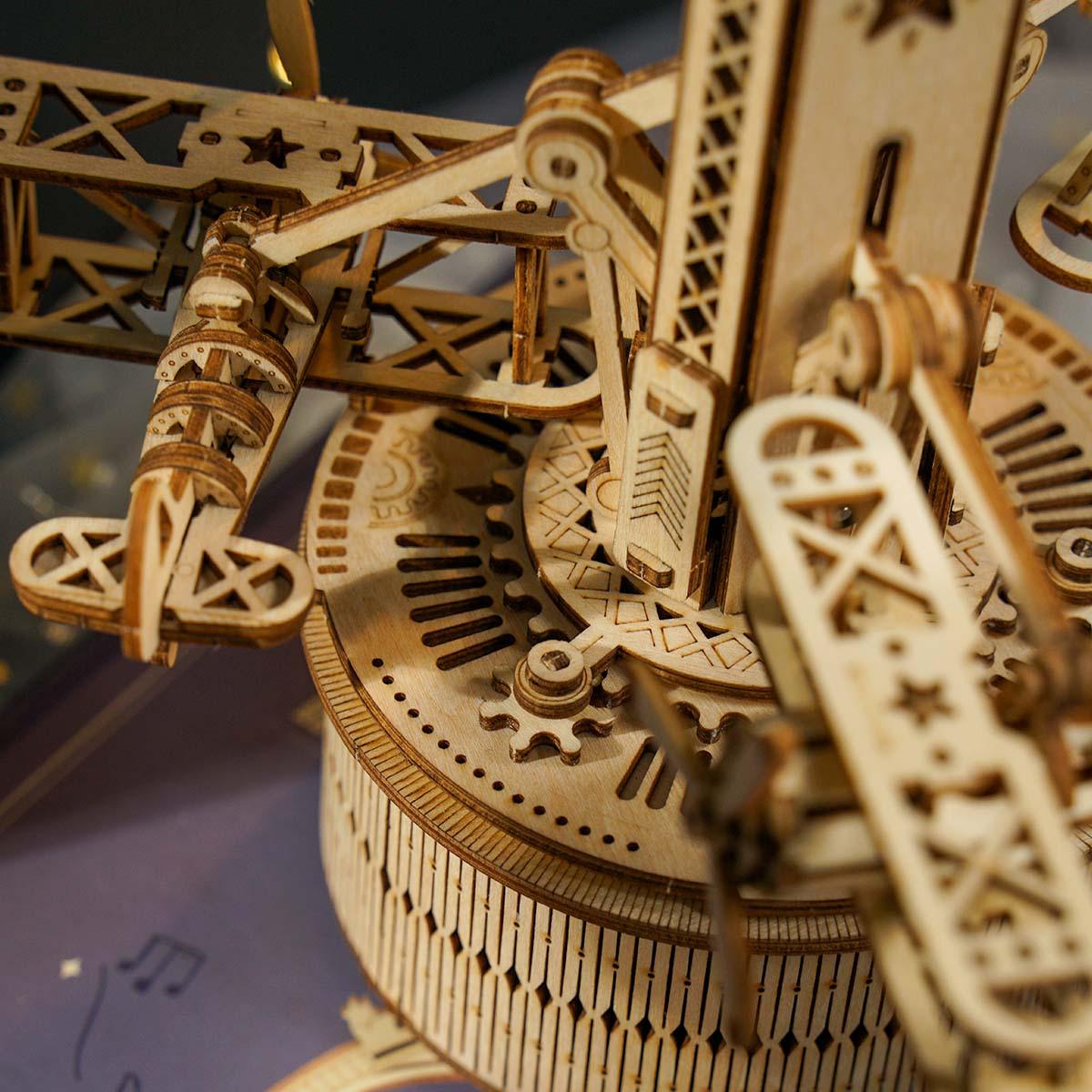Wooden control tower model with three biplanes rotating on gear-driven motion, a wind-up music box for aviation fans