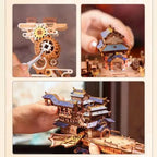 Assembling the Sky Voyager wooden airship kit by hand, fitting numbered laser cut gears and pavilion roof pieces