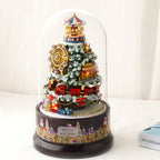 Snowy Christmas tree miniature kit finished under a glass dome with a carousel, Ferris wheel and train, a festive LED music box