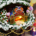 Illuminated circus archway with a clown and wrapped gifts on a snowy tree, a whimsical winter carnival miniature craft kit