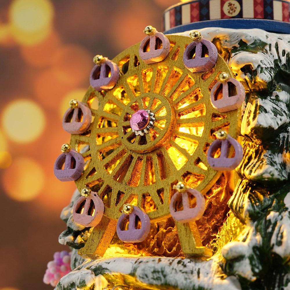 Golden Ferris wheel with purple gondolas glowing on a snowy winter carnival tree, a detailed Christmas miniature kit for adults