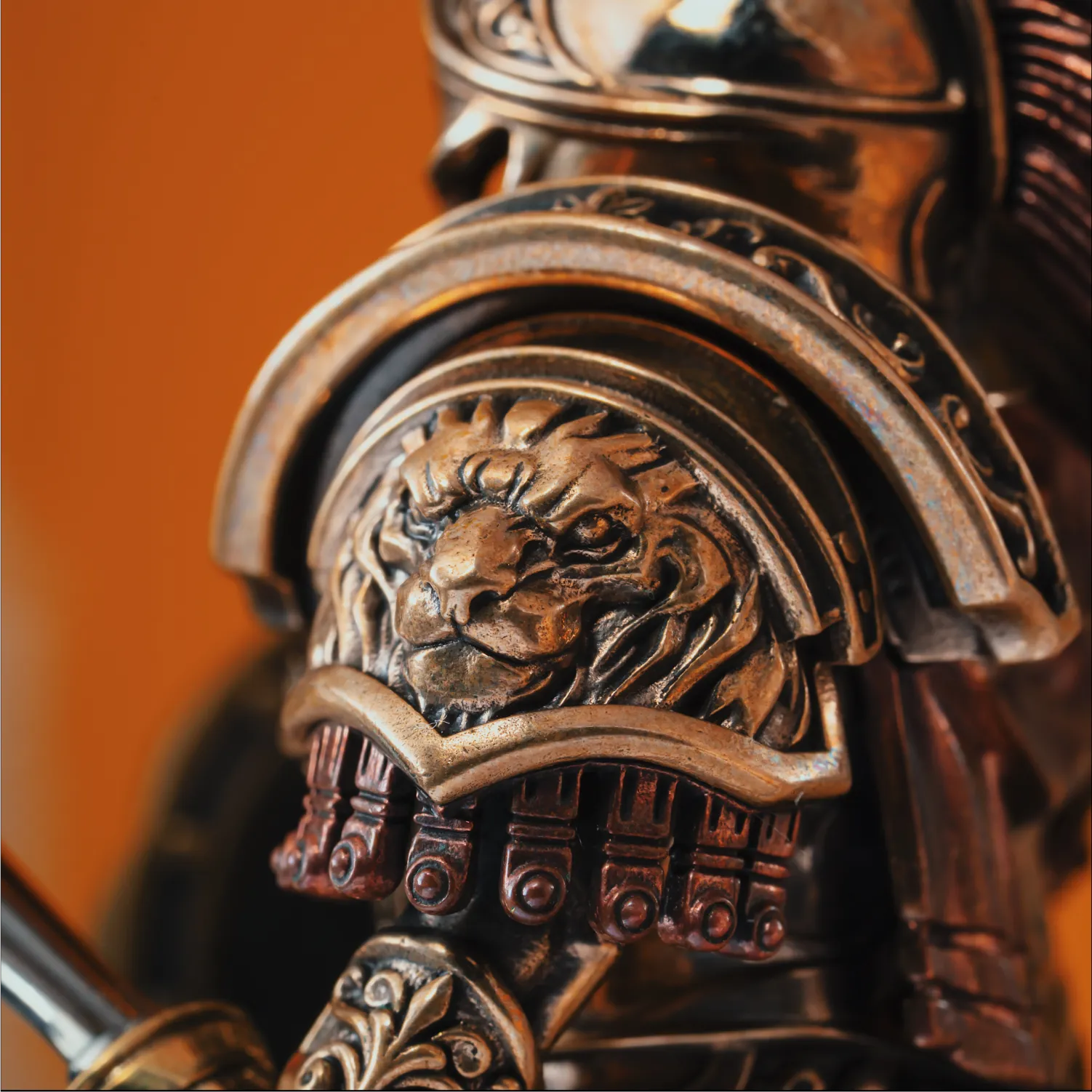 Hand engraved lion shoulder armor on a bronze Spartan warrior figurine, showing the 24 step antique patina craftsmanship SPARTAN-FIGURINE-1