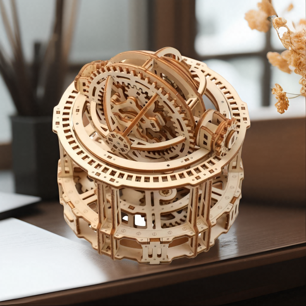 Kinetic desk sculpture and armillary sphere model for a home office or shelf that appeals to mechanical engineering fans