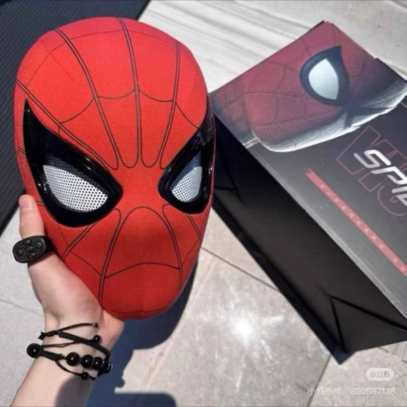 red spiderman mask with moving eyes held beside its costume box, halloween superhero cosplay mask for adults and comic con events SPIDERMAN-MK_RED_CHIN