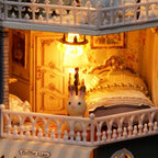 Illuminated 1:24 bedroom with an ornate bed, glowing lamp and floral walls in a handmade miniature dollhouse