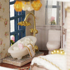 Miniature dollhouse bathroom with a clawfoot tub and gold fixtures, a relaxing craft gift for hobbyists ages 14 up