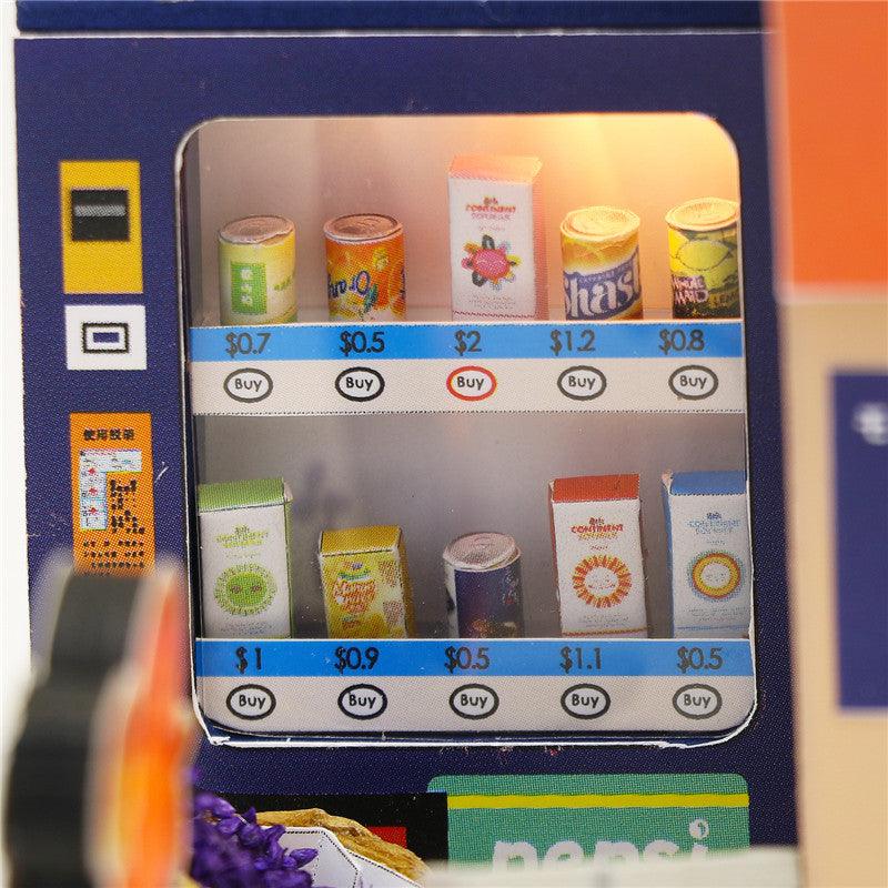 Miniature vending machine stocked with tiny drinks in a 1:24 Japanese food shop dollhouse kit for adult crafters