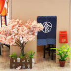 Miniature takoyaki stall corner with cherry blossom tree and noren curtain, a Japanese roombox craft for hobby builders