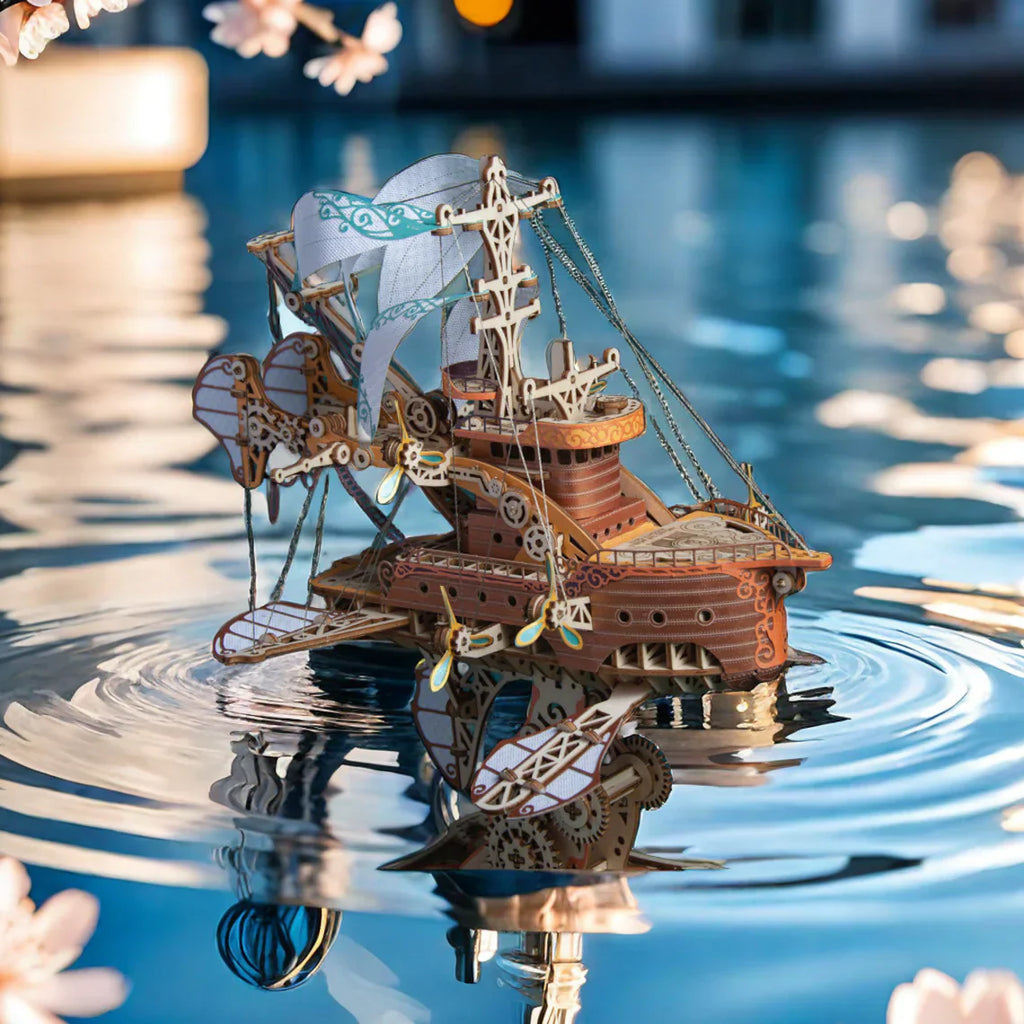 Bamboo airship model with steampunk gears and sails as a fantasy display piece for a home office, studio, or shelf