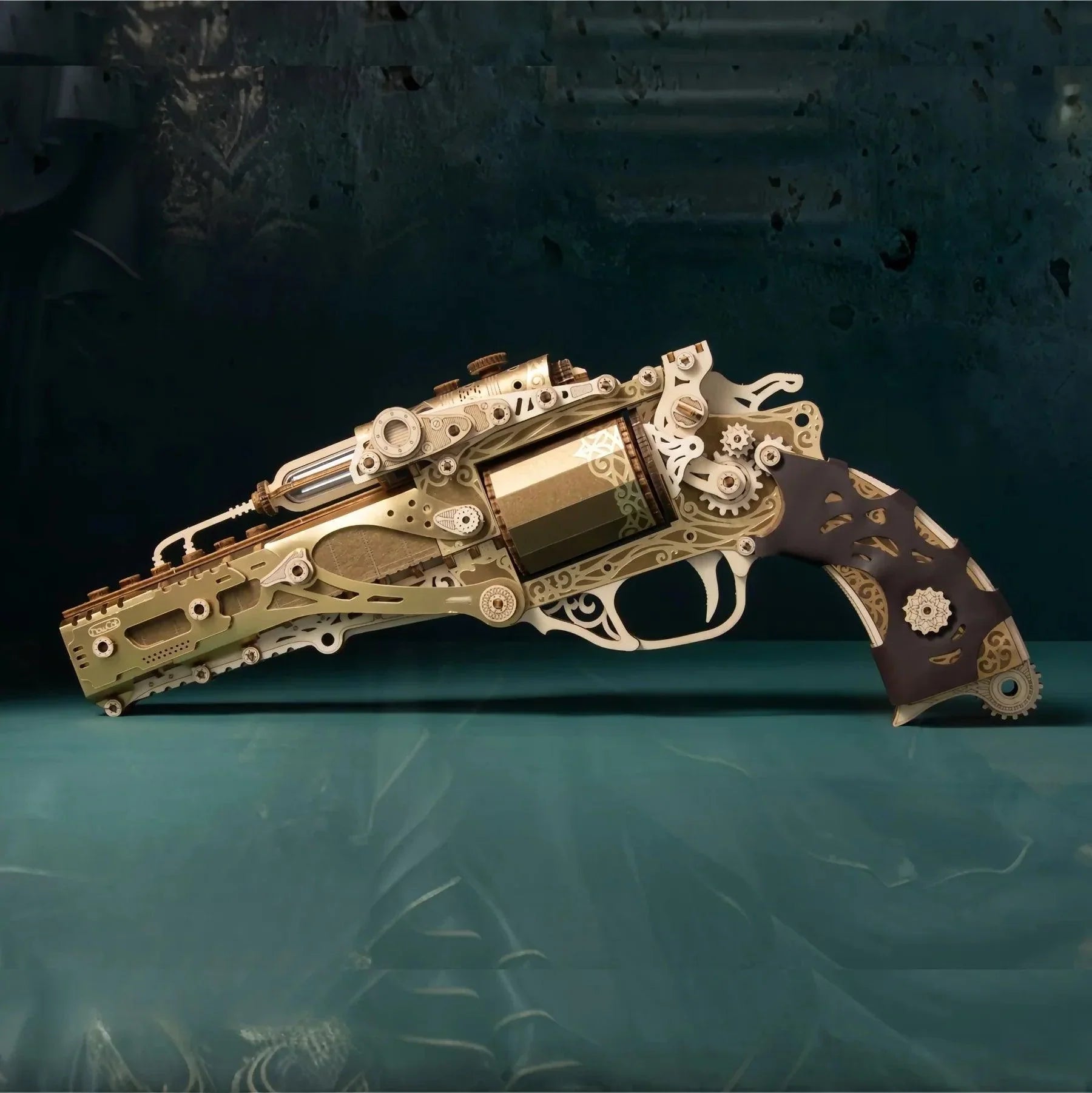 Ornate gold wooden revolver model with a dark carved grip, a mechanical 3D puzzle gun kit and shelf collectible for adults Fantasy Luxury