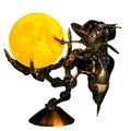 Steampunk wasp 3D metal model kit built from 627 stainless steel pieces on a glowing Jupiter light base for desk decor