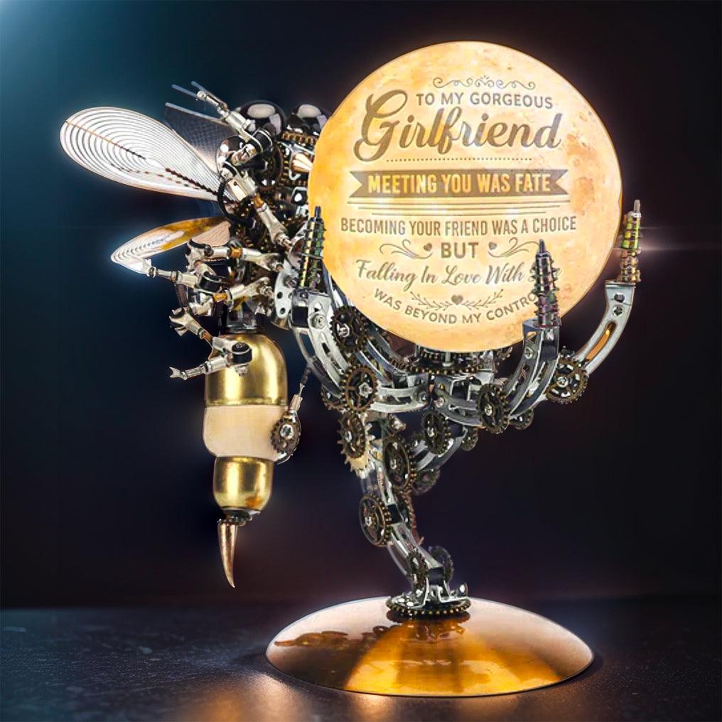Mechanical metal wasp puzzle with 627 laser cut pieces and glue free assembly, finished on the Jupiter light base