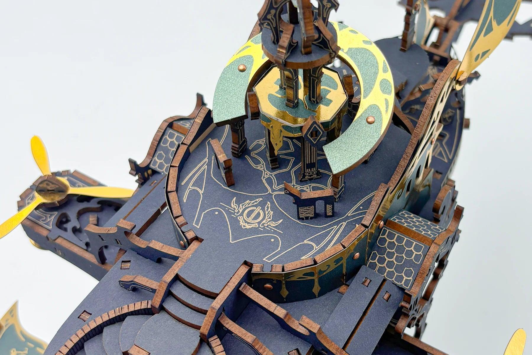 Illuminated deck detail of the birch ship puzzle with foil filigree, an LED model kit for desk and shelf display Blue