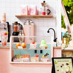 Miniature pastry display case with resin macarons and cakes, a 1:24 bubble tea shop model kit and craft gift for teens Pink