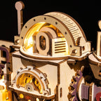 Wooden marble run kit with a lit dome and turning gears, a kinetic STEM building project for teenagers and adult hobbyists