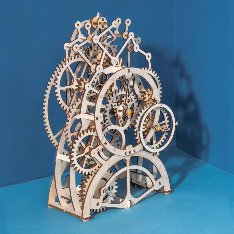 Buildable 3D wooden puzzle clock with a swinging pendulum, laser cut parts assembling into a kinetic mechanical model