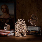 Mechanical wooden clock as vintage shelf decor, a wind up gear clock and grandfather style display for a home or study