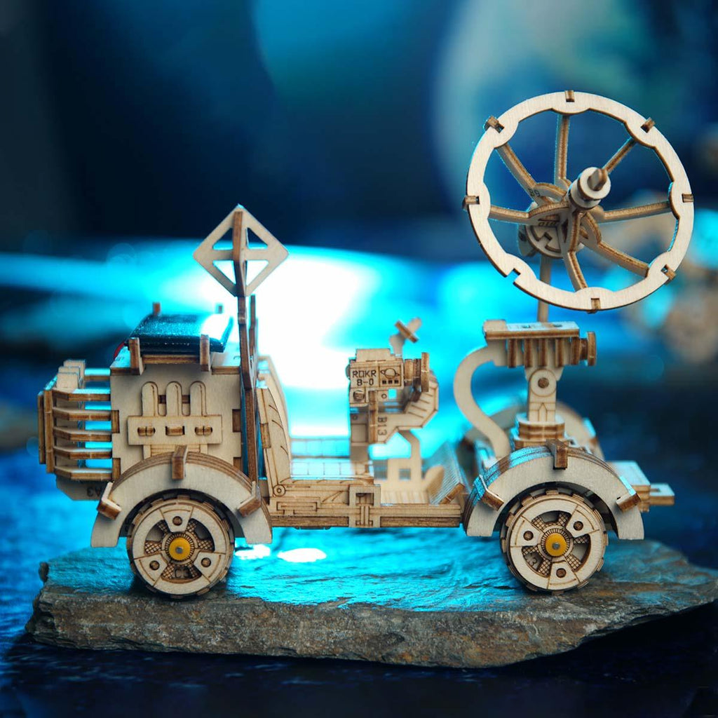 NASA inspired wooden rover with two seats, a hand controller, and a high-gain antenna, a STEM model for young space fans